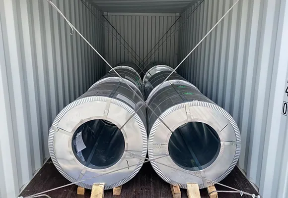 Secured galvanized coils inside container.webp